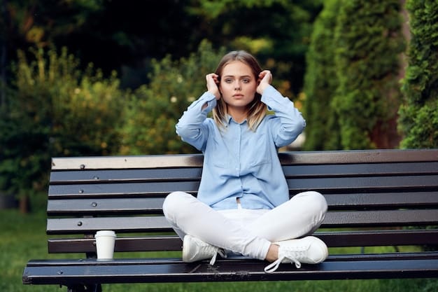 A person sitting on a park bench looking worried while holding their head, with a financial chart blurred in the background, symbolizing regret over 401(k) mistakes and the importance of avoiding them.
